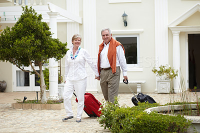 Buy stock photo Travel, hotel and happy senior couple walking with suitcase in a holiday or vacation location in retirement together. Bag, smile and elderly people on a journey or man and woman walk in happiness