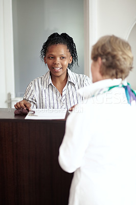 Buy stock photo Hotel receptionist, hospitality and a black woman helping a senior tourist to check in at a luxury resort. Concierge, travel or holiday getaway with a happy female secretary in a lodge for assistance