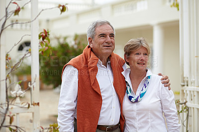 Buy stock photo Embrace, smile and old couple outside hotel, villa and love on luxury retirement vacation together. Marriage, travel and romantic holiday accommodation, senior man and woman in courtyard hugging.
