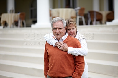 Buy stock photo Hug, portrait and an old couple on hotel steps for travel, vacation or tourism in luxury accommodation. Love, retirement or hospitality with a senior man and woman hugging on a resort staircase