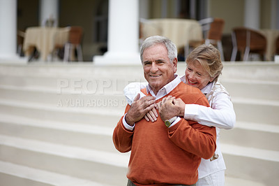 Buy stock photo Hug, hospitality and an old couple on hotel steps for travel, vacation or tourism in luxury accommodation. Love, relax or retirement with a senior man and woman hugging on the staircase of a resort