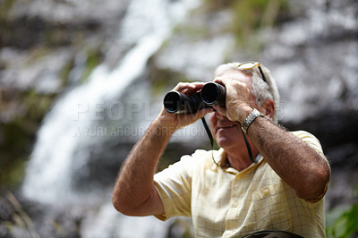 Buy stock photo Binoculars, forest and man explore in forest of travel, journey or outdoor adventure and carbon footprint tourism. Watch, search and senior person birdwatching in nature, mountains or eco environment