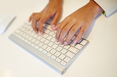 Buy stock photo Cropped shot of a woman's hands on a computer keyboard