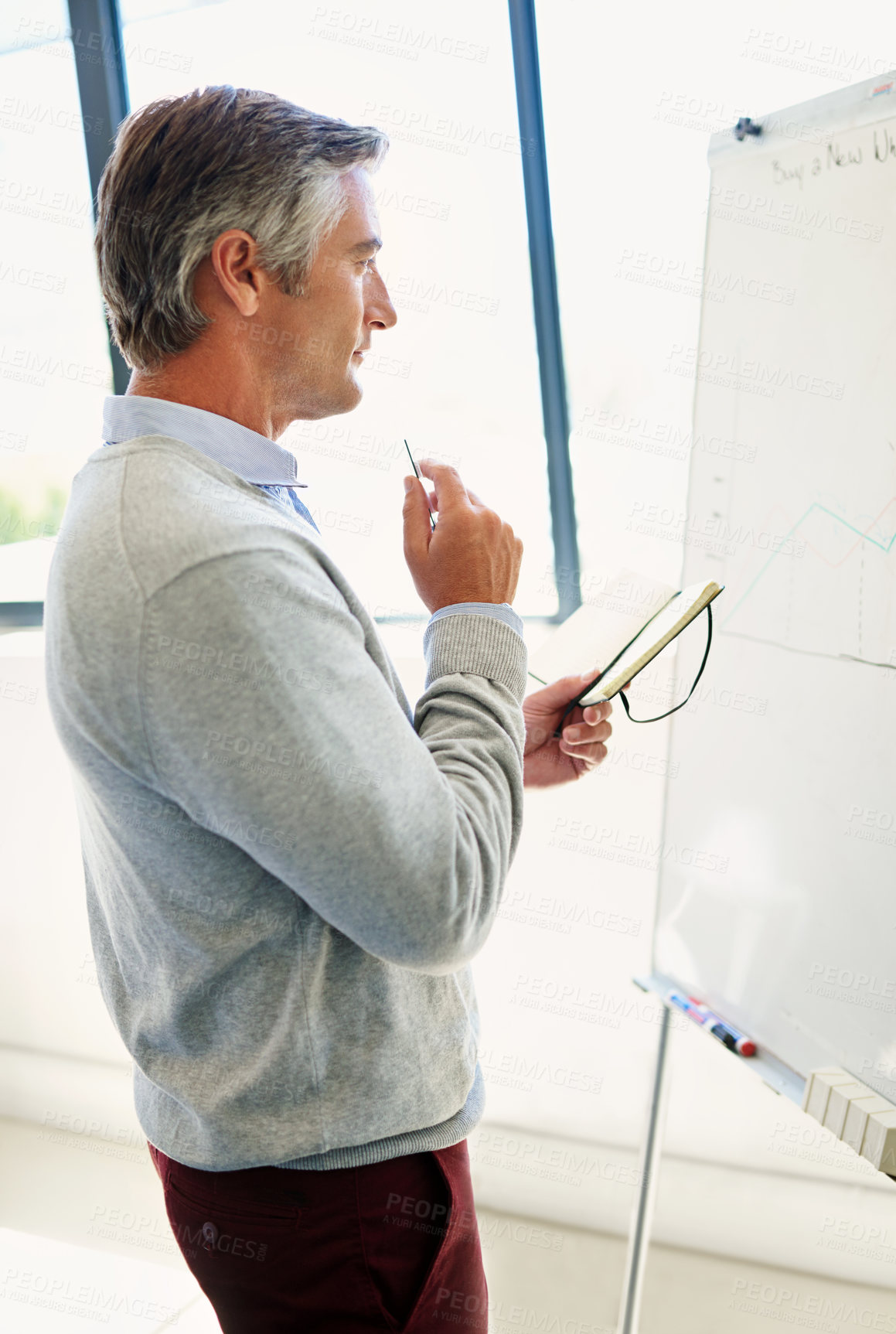 Buy stock photo Businessman, office and thinking with statistics on whiteboard for planning and company growth. Mature person, notebook and graphs for financial report with analysis, feedback and results on research