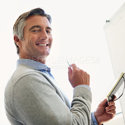 Buy stock photo Businessman, portrait and smile with notebook on whiteboard for planning and company growth. Mature person, proud and office for financial report with analysis, feedback and results on revenue