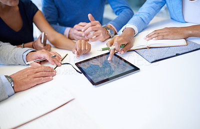 Buy stock photo Hands, group and tablet on desk for teamwork, business people or planning strategy together in workplace. Team building, touchscreen and analysis for ideas, brainstorming or problem solving in office