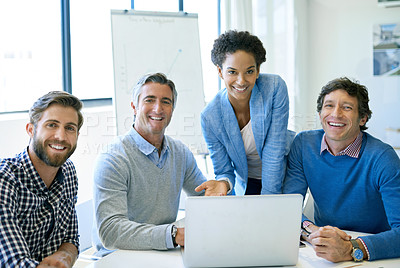 Buy stock photo A group of businesspeople sitting with a laptop in the boardroom