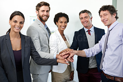Buy stock photo Portrait of a group of coworkers standing with their hands stacked