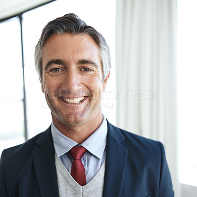 Buy stock photo Portrait of a smiling mature businessman in his office