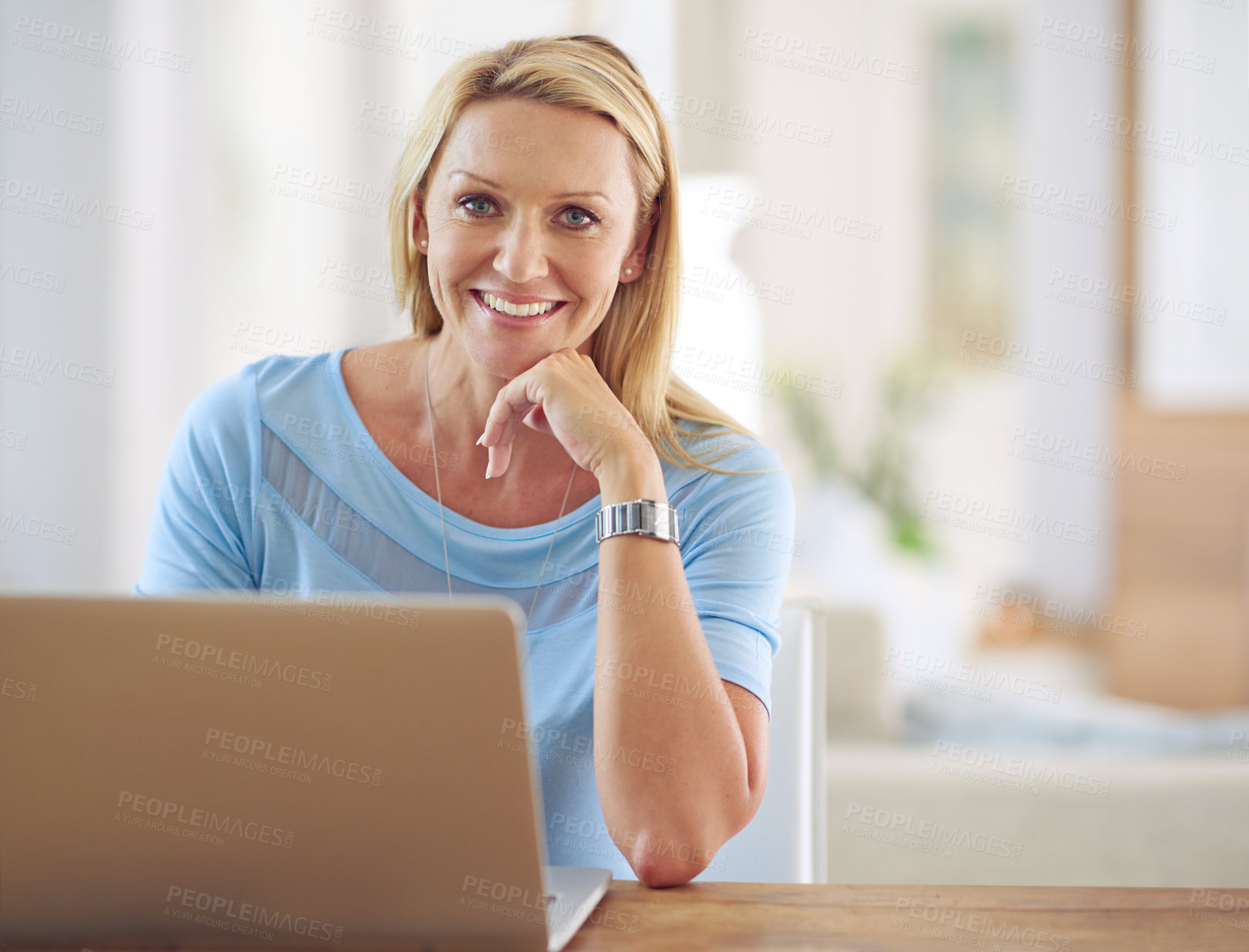 Buy stock photo Portrait of a mature woman using a laptop at home