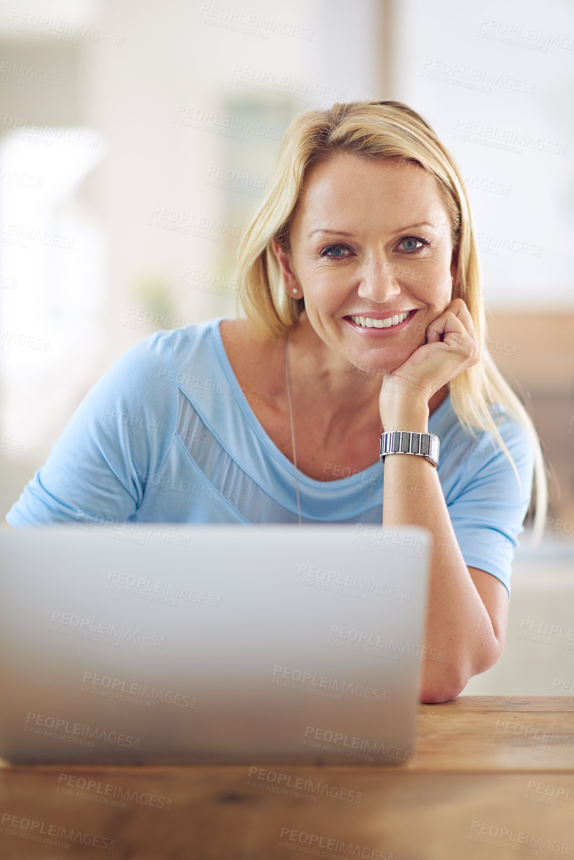 Buy stock photo Portrait of a mature woman using a laptop at home