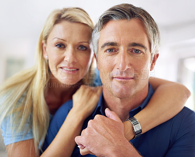 Buy stock photo Portrait of an affectionate mature couple at home