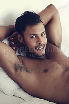 Buy stock photo Portrait, smile and morning with a sexy man in bed, shirtless after a rest to relax while ready to wake up. Face, happy and body with a handsome or sensual young male model lying topless in a bedroom
