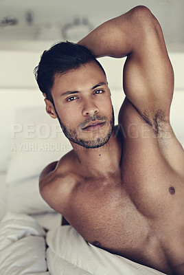 Buy stock photo Portrait, body and wake up with a sexy man lying shirtless in the bedroom of his home in the morning. Relax, arm and muscle with a handsome young male model resting topless in bed for sensuality