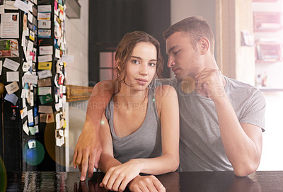 Buy stock photo Shot of a young couple sitting in a coffee shop