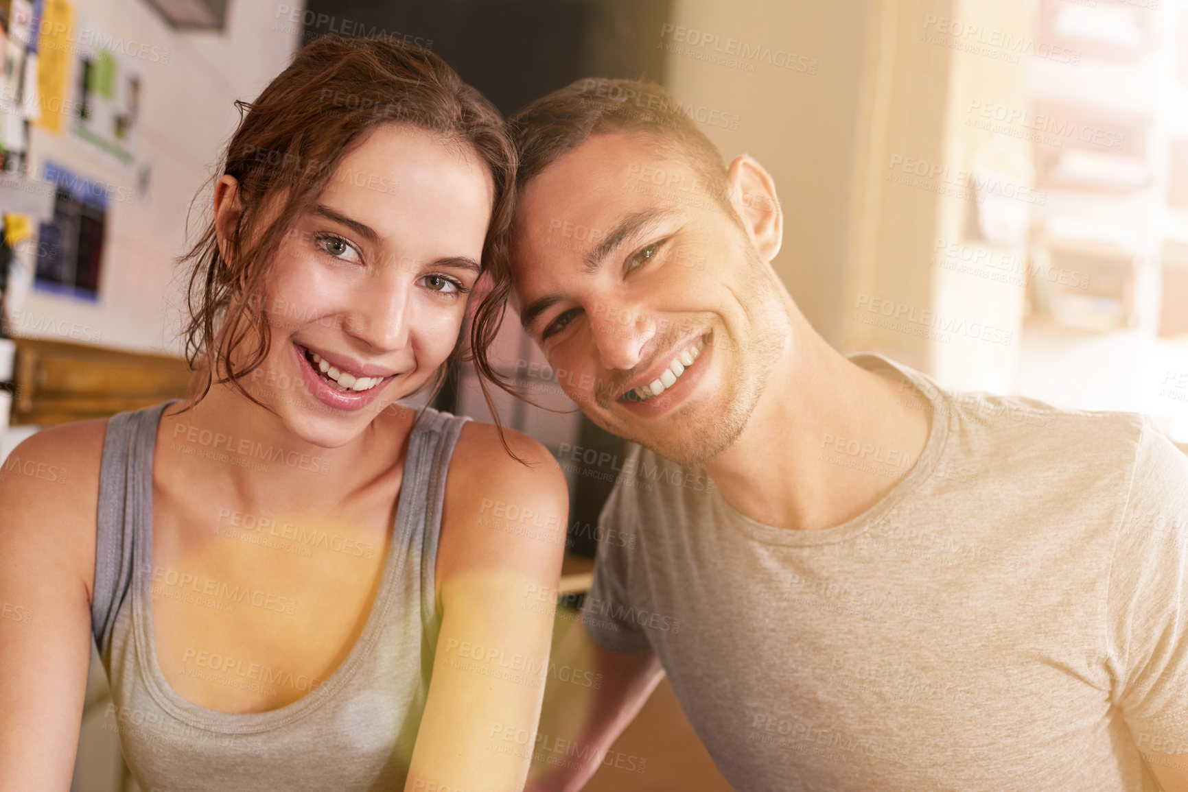 Buy stock photo Shot of a young couple sitting in a coffee shop