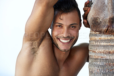 Buy stock photo Man, portrait and topless out for travel holiday with confidence at palm tree, summer or vacation. Male person, face and smile shirtless in Thailand for exploring at tropical island, healthy or trip