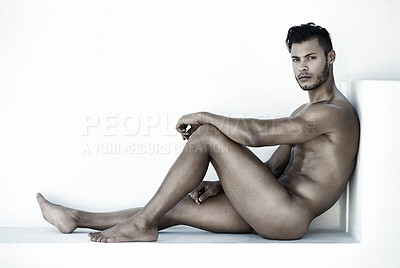 Buy stock photo Shot of a handsome young man posing nude