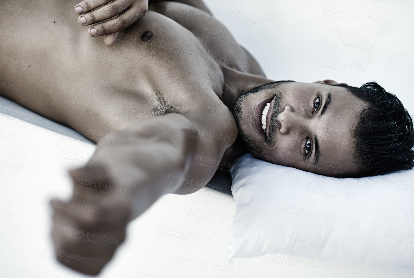 Buy stock photo Rest, portrait of happy man on bed and head on pillow in bedroom for comfort at his home. Shirtless or topless person, confidence and smiling or strong male model relaxing in a white background.