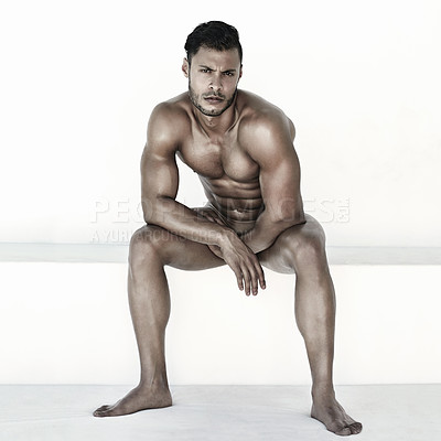 Buy stock photo Nude, body and man in portrait isolated on a wall background for health, fitness and wellness. Naked, strong and face of a sexy male model sitting with muscles for power, sports and exercise results