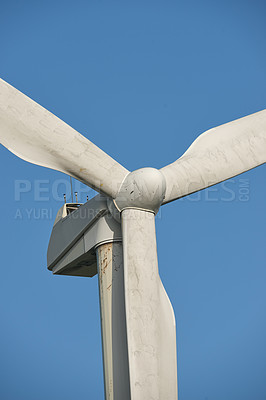 Buy stock photo Windmill, renewable energy and environment by blue sky for sustainability with natural power source. Wind turbine, blades and infrastructure to supplement supply grid for clean electricity in Denmark