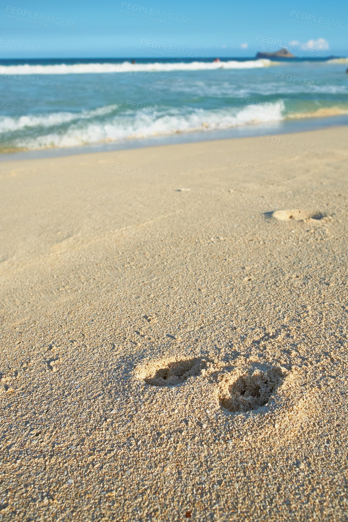 Buy stock photo Nature, ocean and footprints in sand for travel, vacation or holiday in summer by coastal island. Walk mark, steps and sea waves on LaniKai beach for tropical weekend trip at destination in Hawaii.