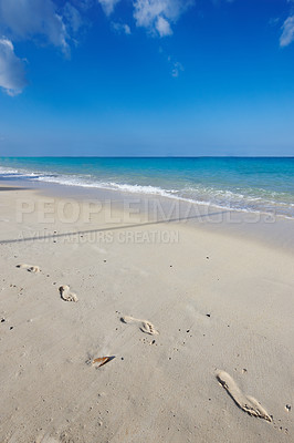 Buy stock photo Hawaii, beach and sand for vacation, travel and holiday in summer at Lanikai. Ocean, water or sea coast with blue sky, nature or clouds on horizon with calm waves with foot prints on land in Kailua