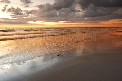 Buy stock photo Sunset, beach and ocean for vacation, clouds and travel to Denmark for summer holiday adventure. Sea, location and sand on coast with sky, nature or horizon with waves on landscape outdoor in Jutland