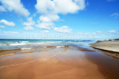 Buy stock photo Blue, sand and water on beach in summer with calm, peace or zen outdoor for holiday, travel or vacation. Earth, nature and tide with view of ocean or sea in Denmark for climate, seashore or trip