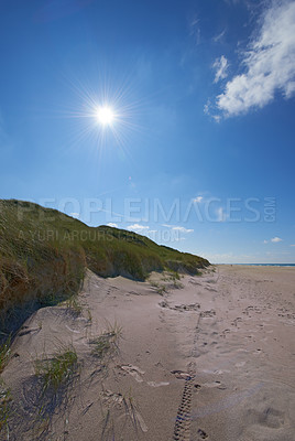 Buy stock photo Travel, sand and nature with sun in blue sky for island getaway, tropical oasis and horizon environment for break. Adventure, paradise beach and holiday haven for summer vacation in Jutland, Denmark.