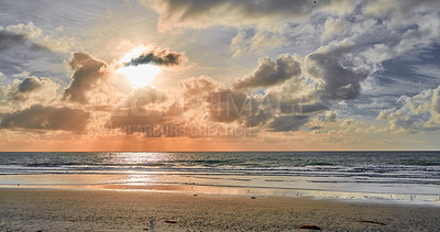 Buy stock photo Nature, sunset and wallpaper of beach with sky in season for summer holiday, travel or vacation. Clouds, earth and sand with horizon on ocean for background, environment or tropical island reflection