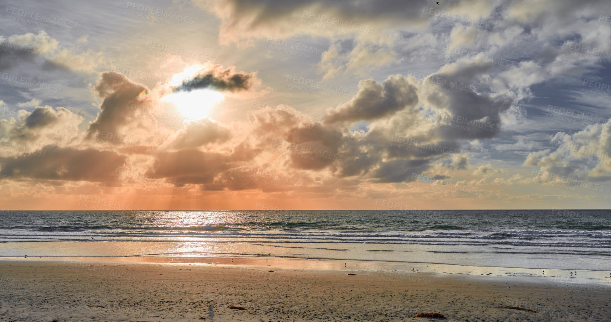 Buy stock photo Nature, sunset and wallpaper of beach with sky in season for summer holiday, travel or vacation. Clouds, earth and sand with horizon on ocean for background, environment or tropical island reflection