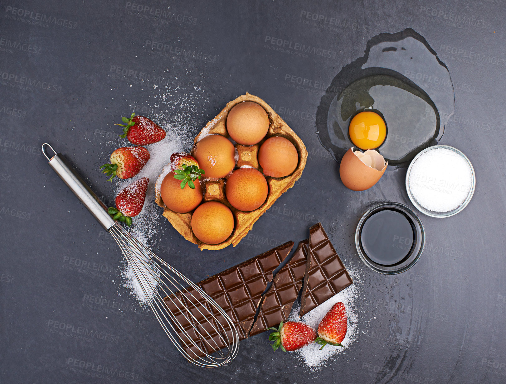 Buy stock photo Above, baking ingredients or chocolate with eggs, flour and strawberry with sugar on table in kitchen. Fruit, background or cooking products on counter for meal, food recipe or dessert for protein