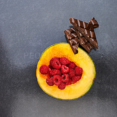 Buy stock photo Fruit, healthy raspberries or chocolate in restaurant for balanced diet, nutrition or natural vitamin A. Vegan, top view or organic cantalope on kitchen countert for meal or snack on gray background