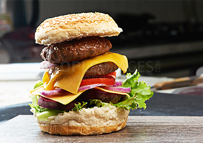 Buy stock photo Beef, burger and cheese on menu in restaurant with lettuce, tomato and onion on bread bun in kitchen. Bbq, hamburger and fast food with meat and salad from fine dining diner for dinner or lunch