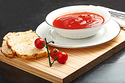 Buy stock photo Tomato, soup and bread on menu in restaurant with bowl of healthy food for diet and nutrition benefits. Dinner, dish and luxury appetizer course in fine dining kitchen with vegetables on board 