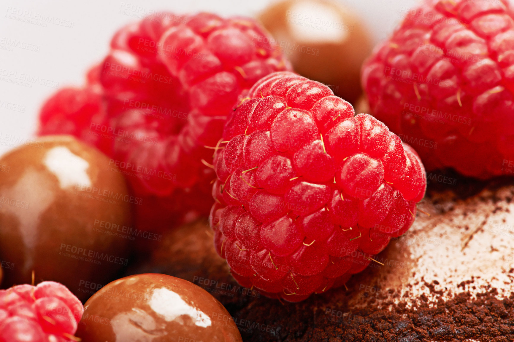 Buy stock photo Raspberry, chocolate and cake with dessert in closeup for eating with sugar in studio with sweets for treats with baking. Food, hungry and cupcake with fruit for gourmet, meal and candy for carbs