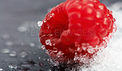 Buy stock photo Closeup, health or raspberry on sugar in kitchen of home on counter for diet, natural vitamin c or nutrition. Vegan, background or fruit on sweet surface in apartment or house for detox or minerals