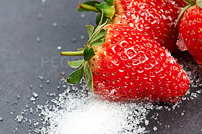 Buy stock photo Closeup, health or strawberry on sugar in kitchen of home on counter for diet, natural vitamin c or nutrition. Vegan, background or fruit on sweet surface in apartment or house for detox or minerals