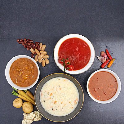 Buy stock photo High angle studio shot of delicious soups on a table