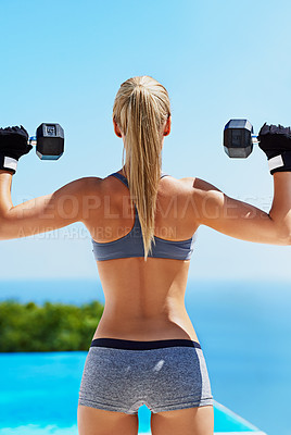 Buy stock photo Shot of a beautiful young woman exercising outside