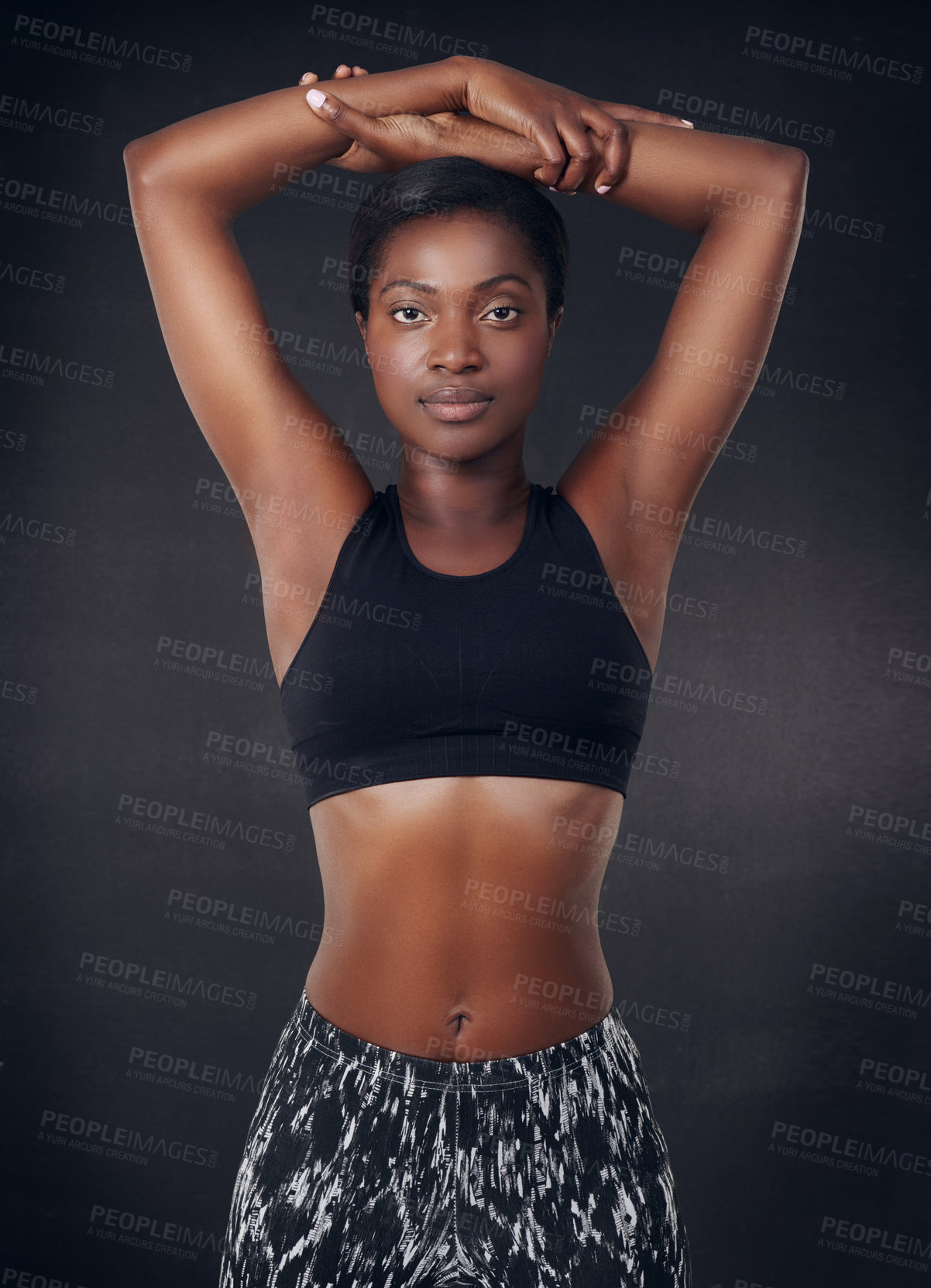 Buy stock photo Stretching, fitness and portrait of black woman in studio for health, personal trainer and gym workout. Wellness, training and warm up with person from Ghana on dark background for exercise.