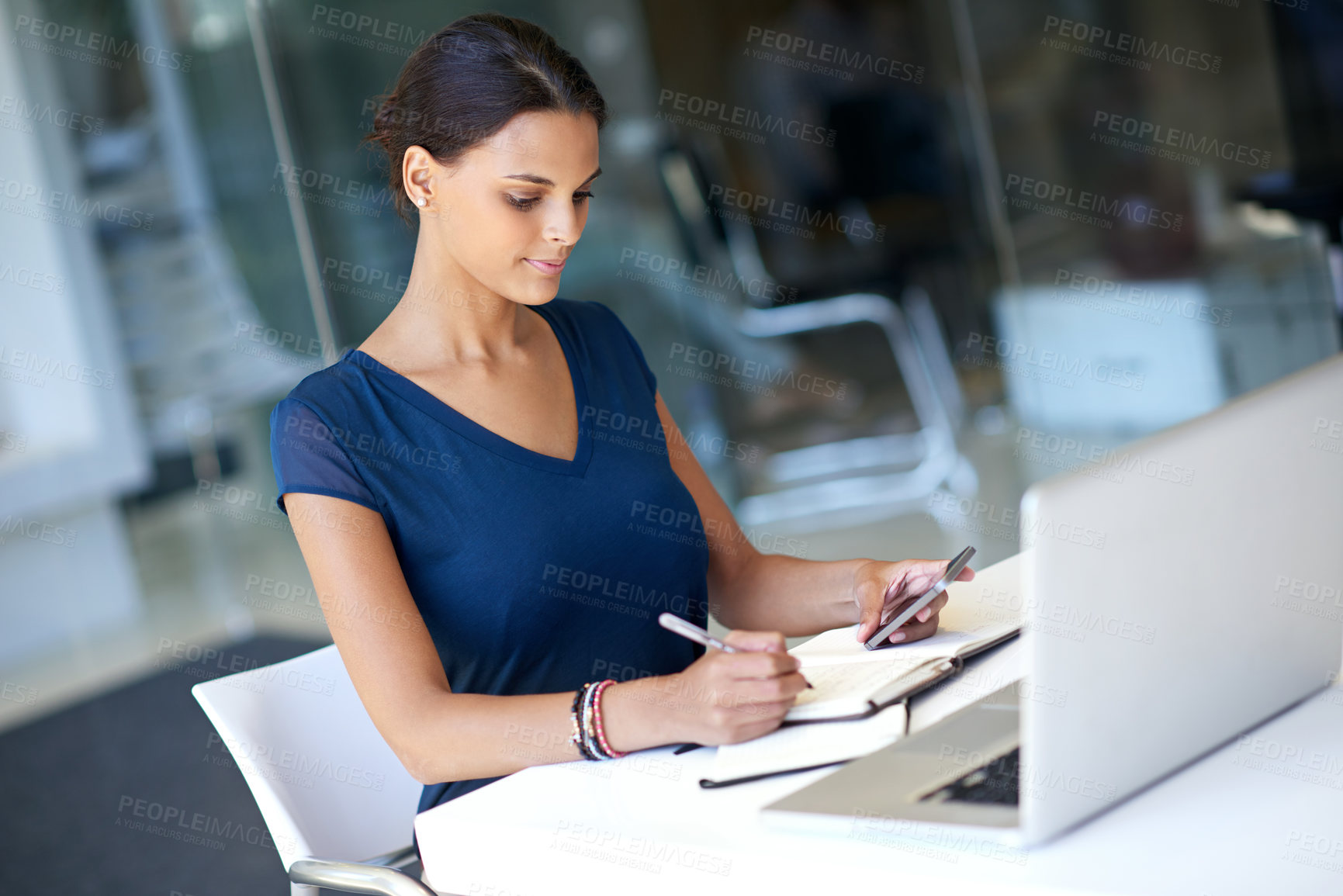 Buy stock photo Secretary, writing and book with phone for schedule planning, notes or work agenda at office. Female person, employee or diary with mobile smartphone for reminder, tasks or workflow at workplace