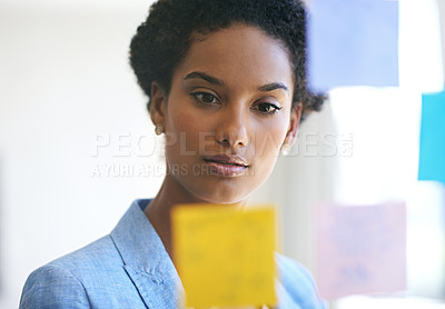 Buy stock photo Shot of a female designer working in a creative office