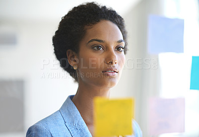 Buy stock photo Shot of a female designer working in a creative office