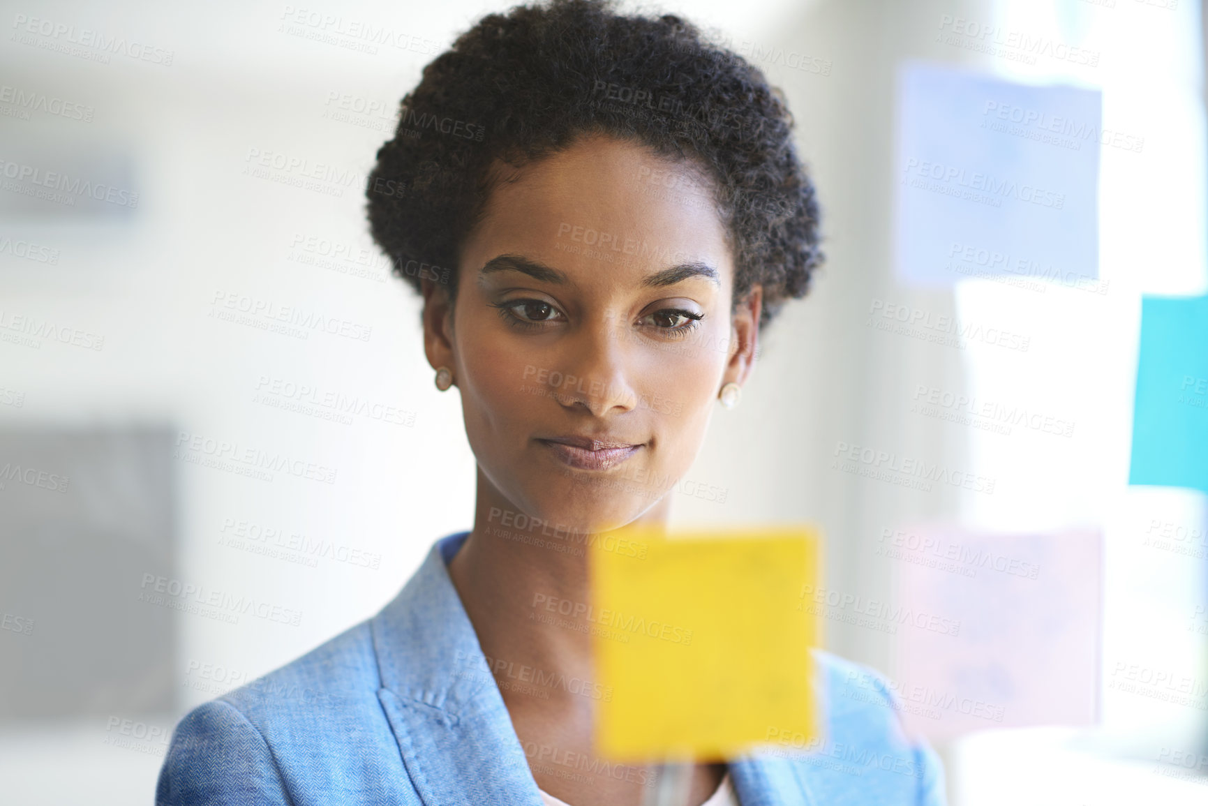 Buy stock photo Shot of a female designer working in a creative office