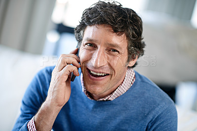 Buy stock photo Shot of a businessman using his cellphone at work in an office