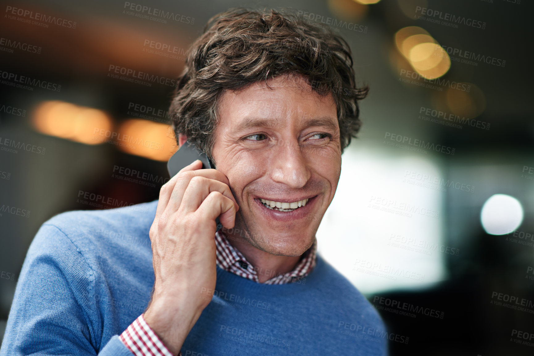 Buy stock photo Shot of a businessman using his cellphone at work in an office