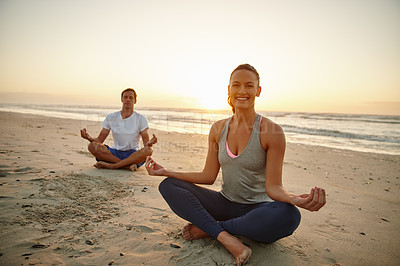 Buy stock photo Portrait of a couple doing yoga on the beach at sunset