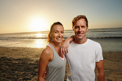 Buy stock photo Portrait of a young couple standing together on the beach